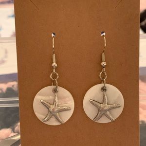 starfish earring on white background